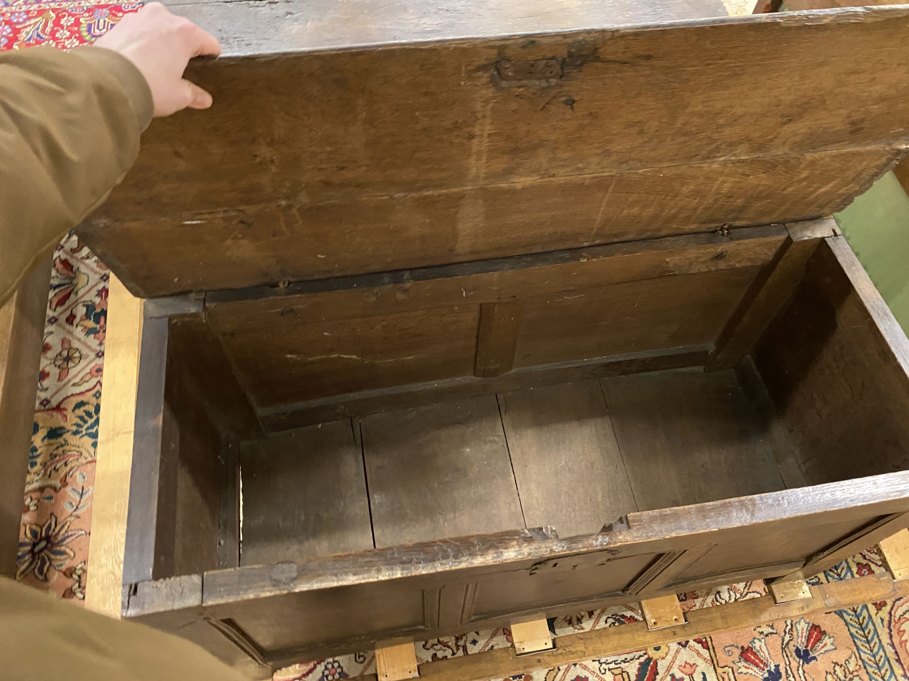An 18th century panelled oak coffer, length 114cm, depth 47cm, height 56cm